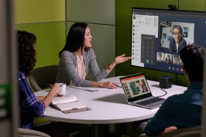 employees in conference room having a virtual meeting